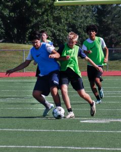 Two players collide as they try to get the ball.