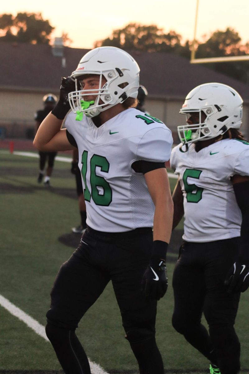 Player smiles at teammates.
