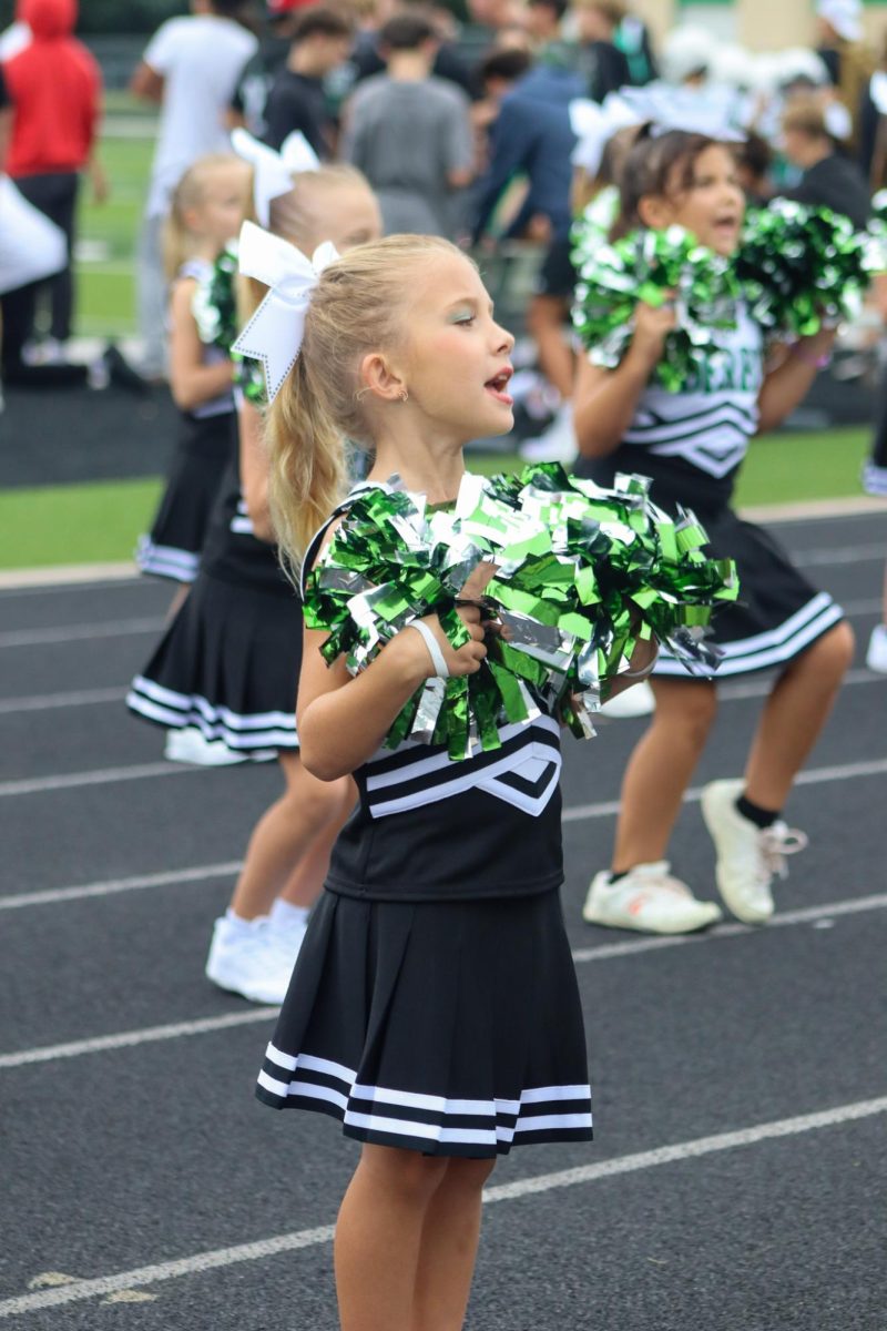 Jr Cheerleader cheering