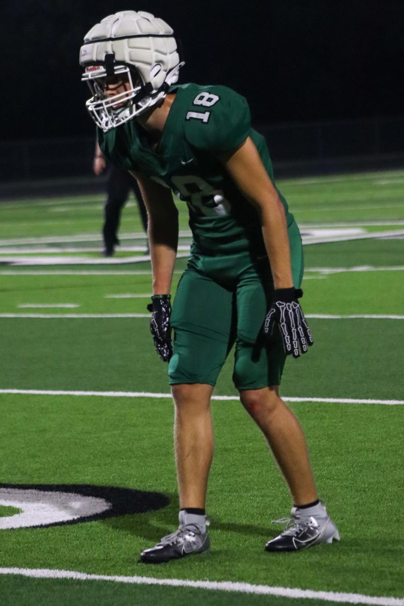 DHS football player getting ready for a play 