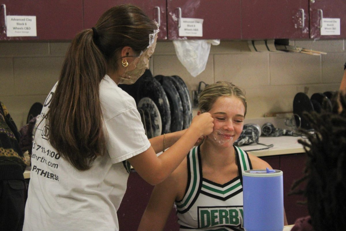 In Mr.McHugh's clay class, students put vaseline and saran wrap on their faces followed by paper mache to create a mask.