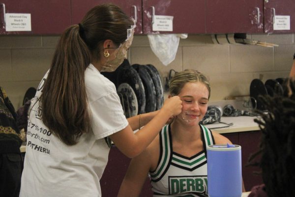 In Mr.McHugh's clay class, students put vaseline and saran wrap on their faces followed by paper mache to create a mask.