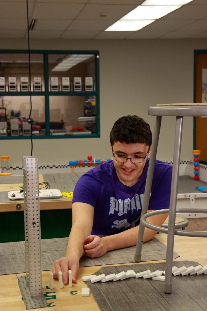 Sophomore Regan French helps build the project.