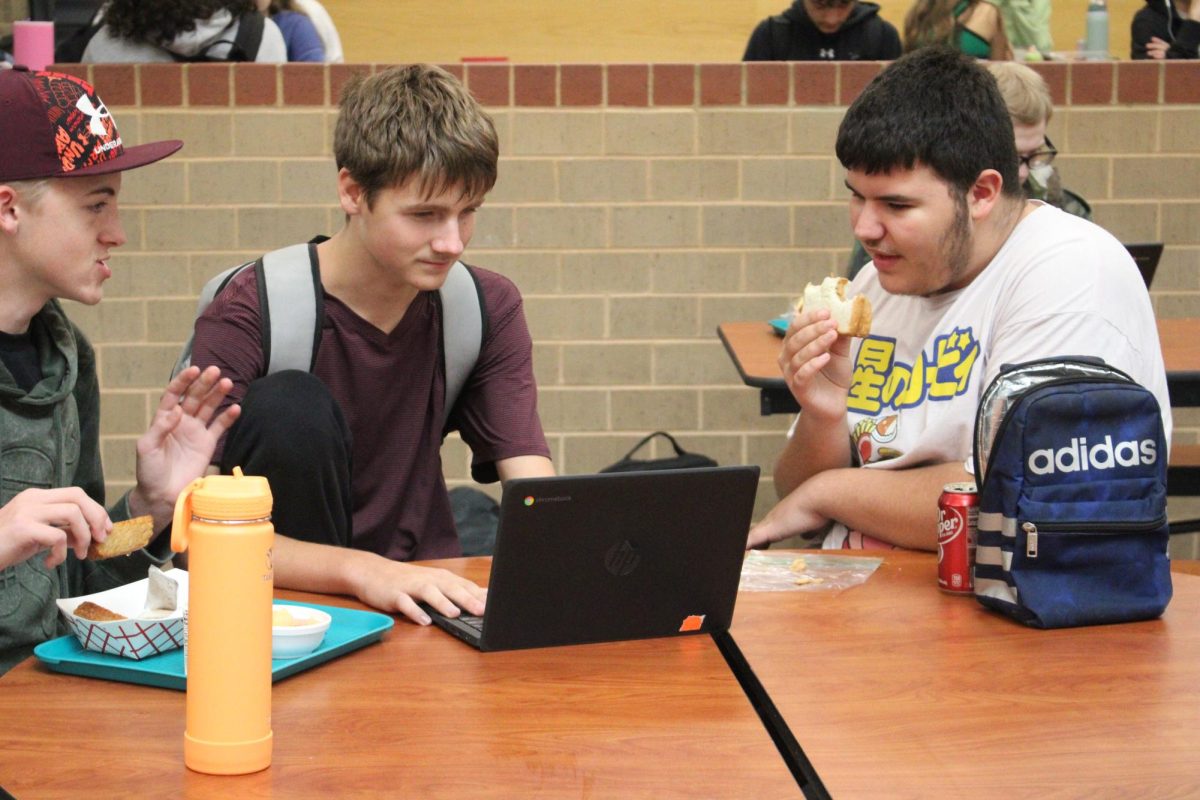 Students looking at computer