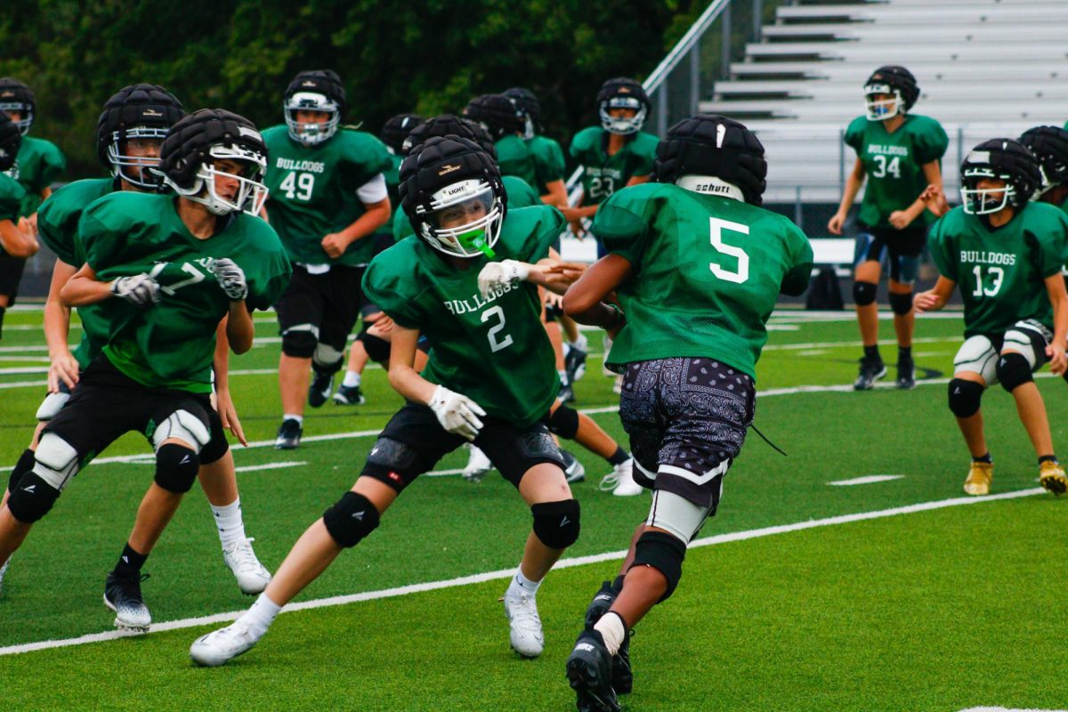 Derby middle school player goes for the tackle.
