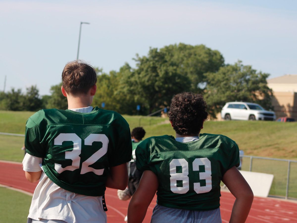 Two players walk together.