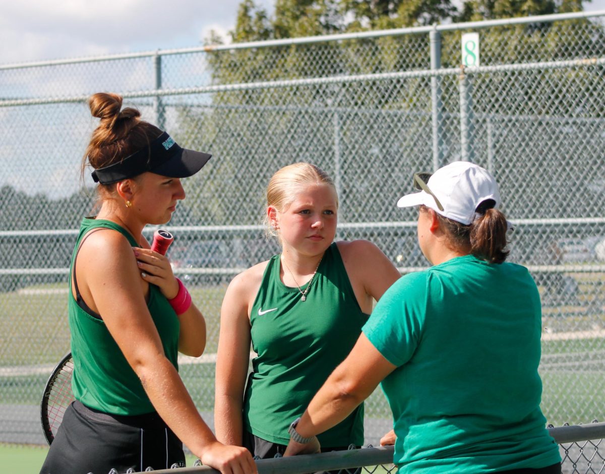 Players talking to their coach.