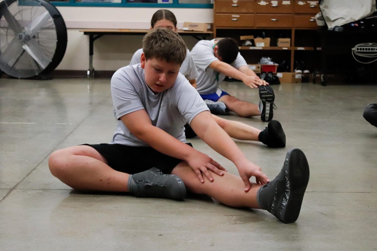 Kids stretching and reaching for toes