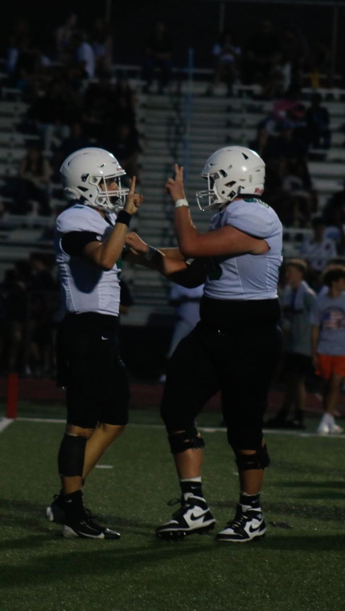Derby football players celebrate touchdown.