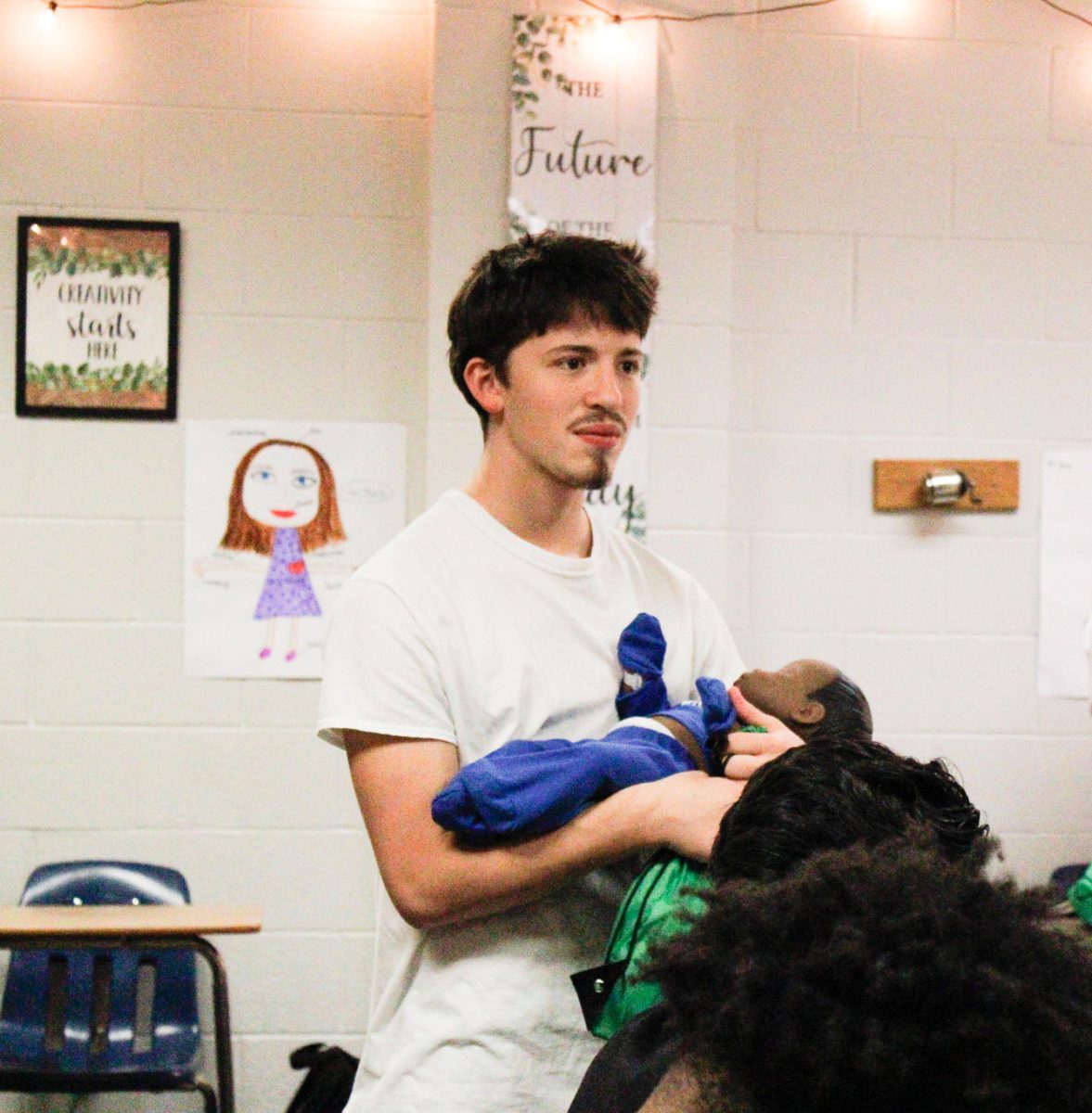Students are currently learning how to correctly operate baby carriers in Family Studies.