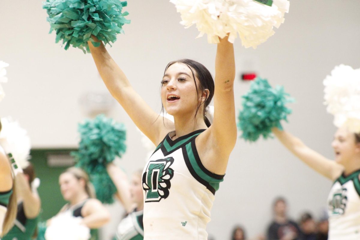 Cheerleader during the fall pep assembly introduction.
