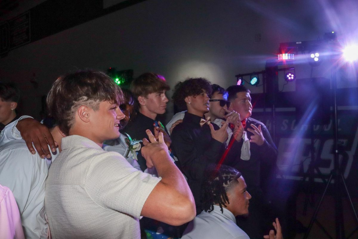 Students pose for photos at the homecoming dance.