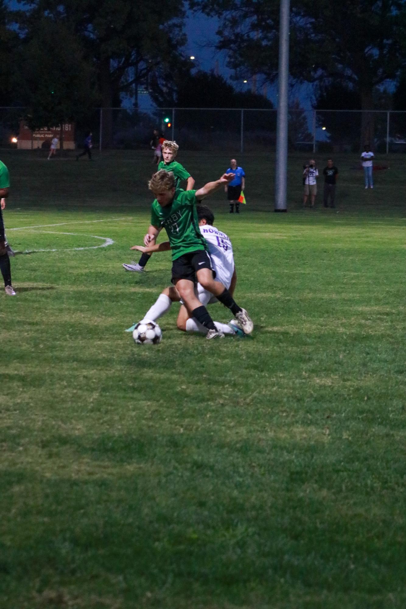 Player tries to take the ball away.