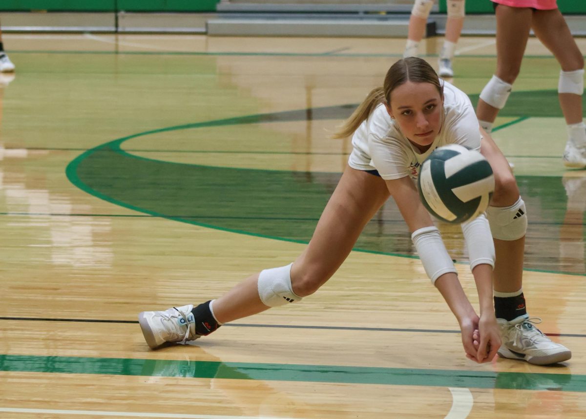 Volleyball player receives the ball.