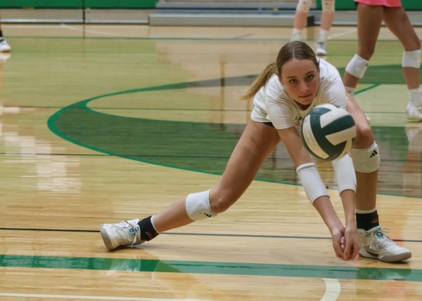 Volleyball player receives the ball.