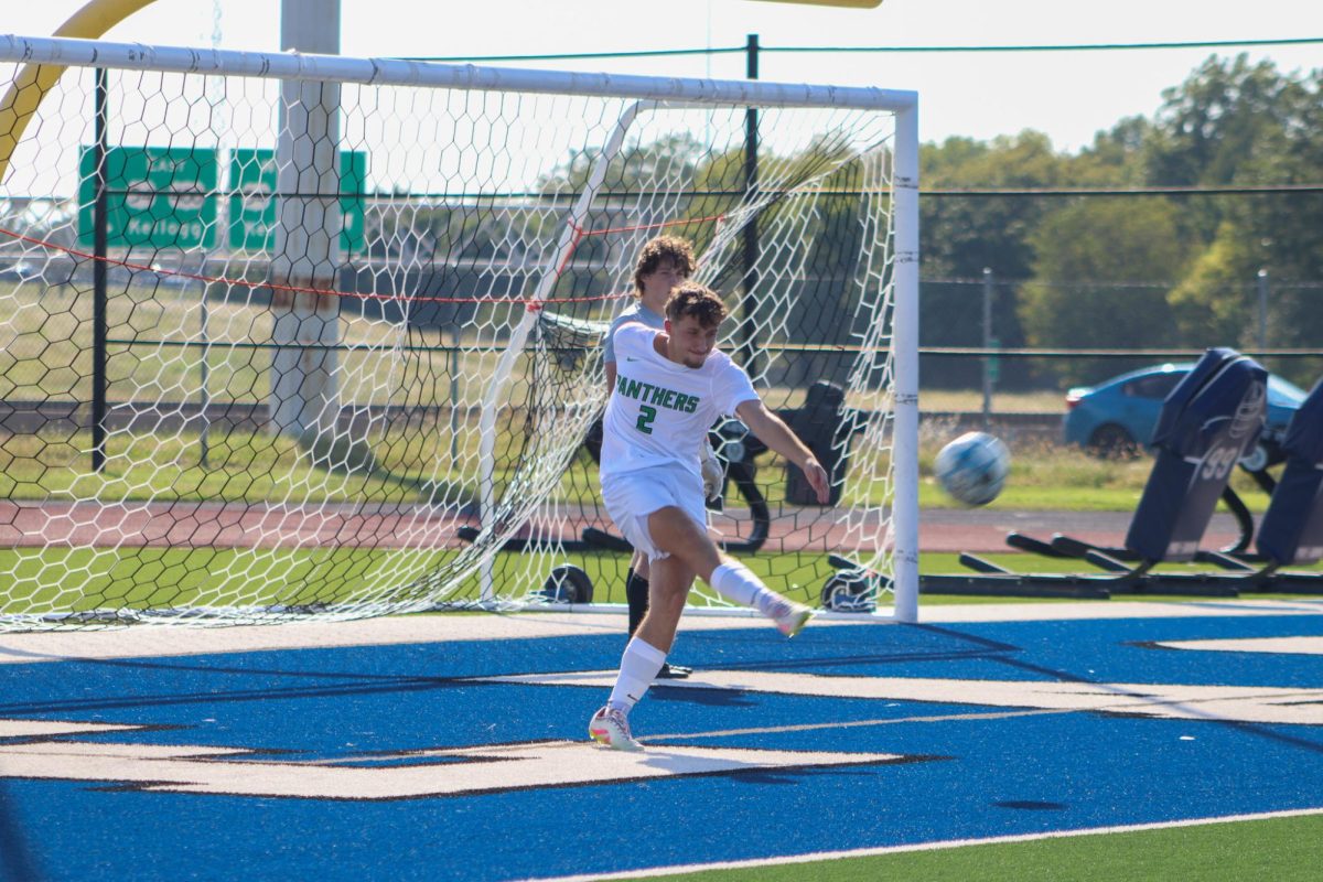 player Kicking ball back in to game 