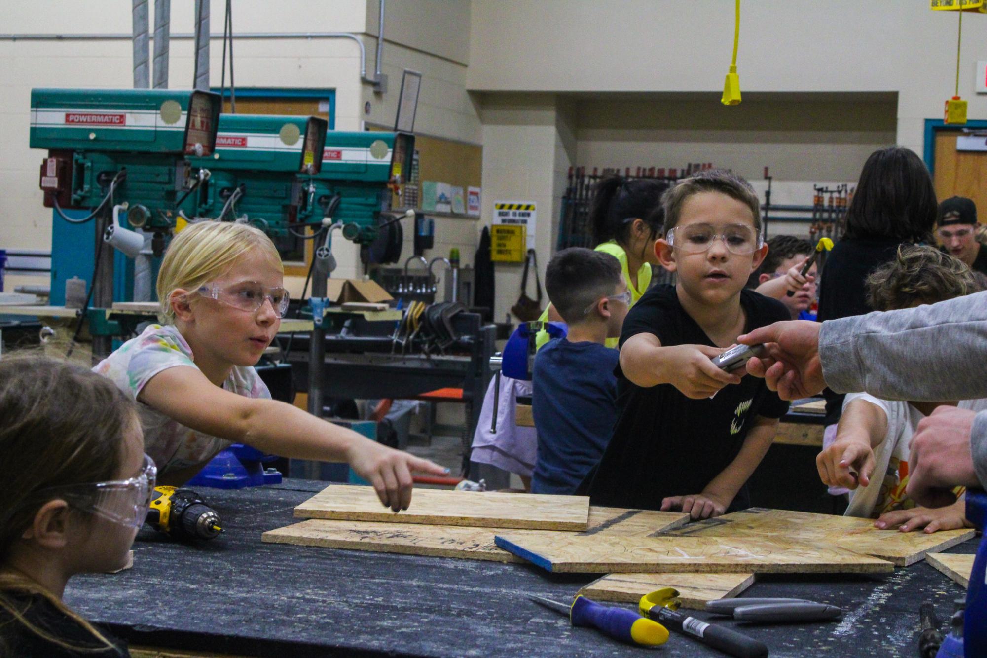 3rd grade students building Bat Houses (Photos By Ava Phouangmala)