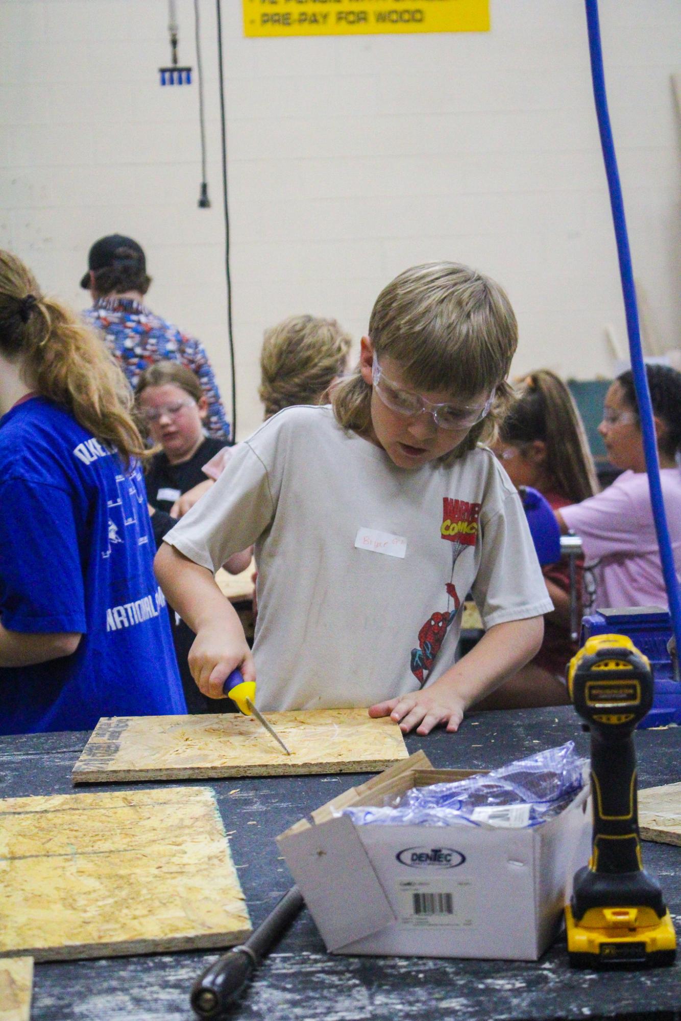 3rd grade students building Bat Houses (Photos By Ava Phouangmala)