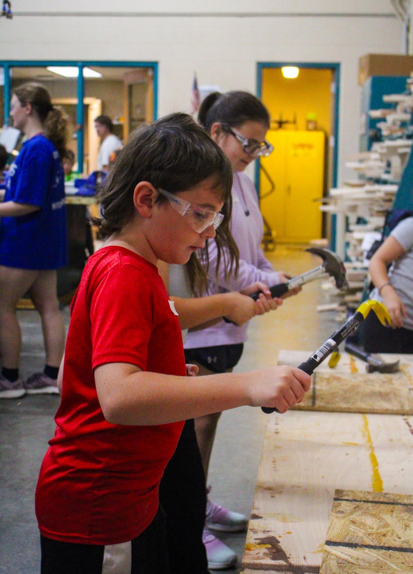 3rd grade students building Bat Houses (Photos By Ava Phouangmala)