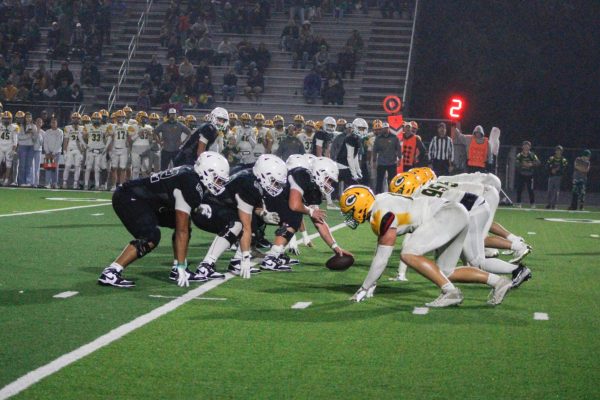 Players line up for the next play. 