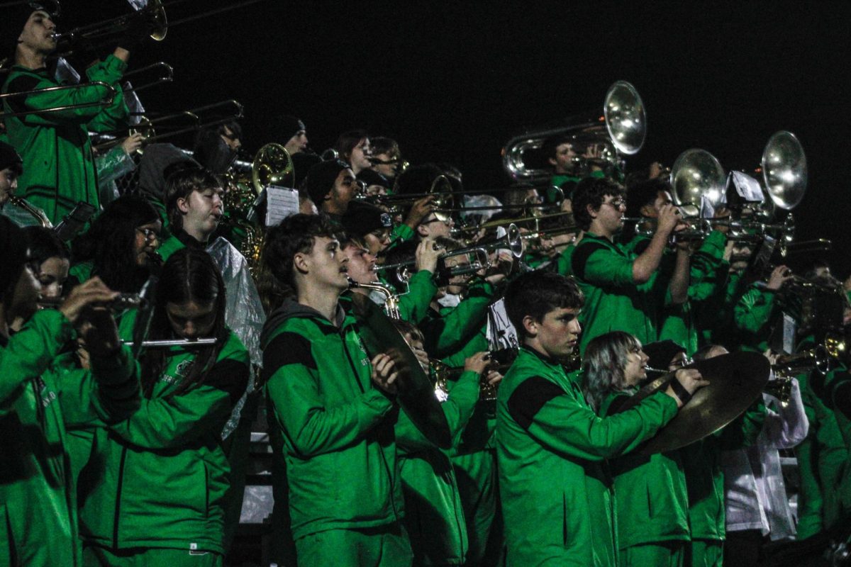 The band plays the last song at the football game. 