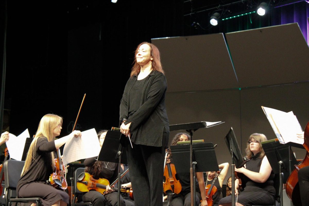 Orchestra Conductor turned towards the crowd