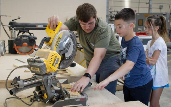 Panther helping a Tanglewood Tiger with the saw.