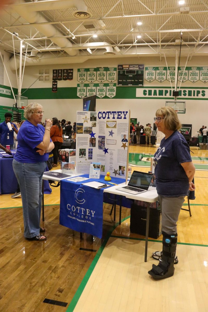 College sponsors talk to one another. 