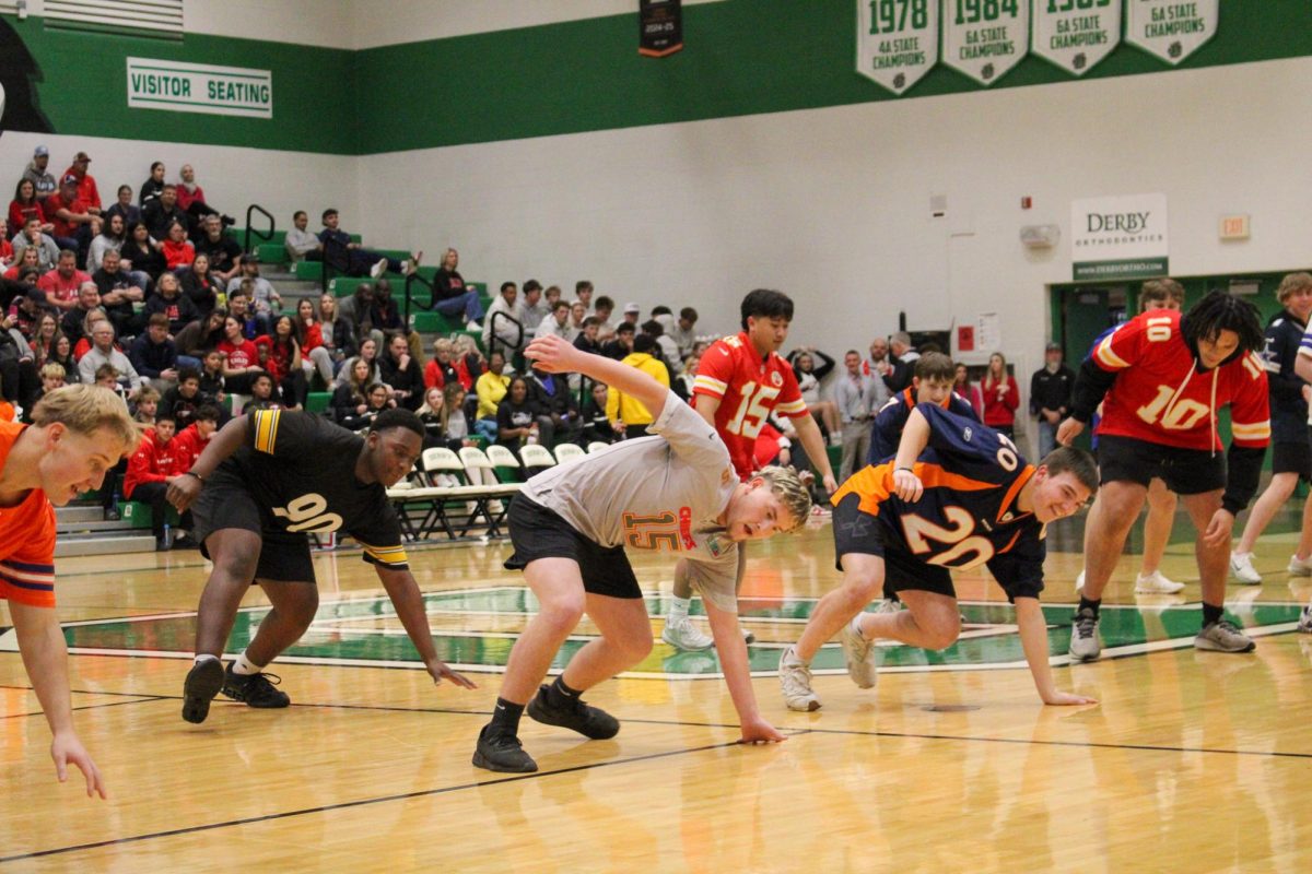 During the Varsity Boys Basketball game, Mantherettes perform in front of crowd.