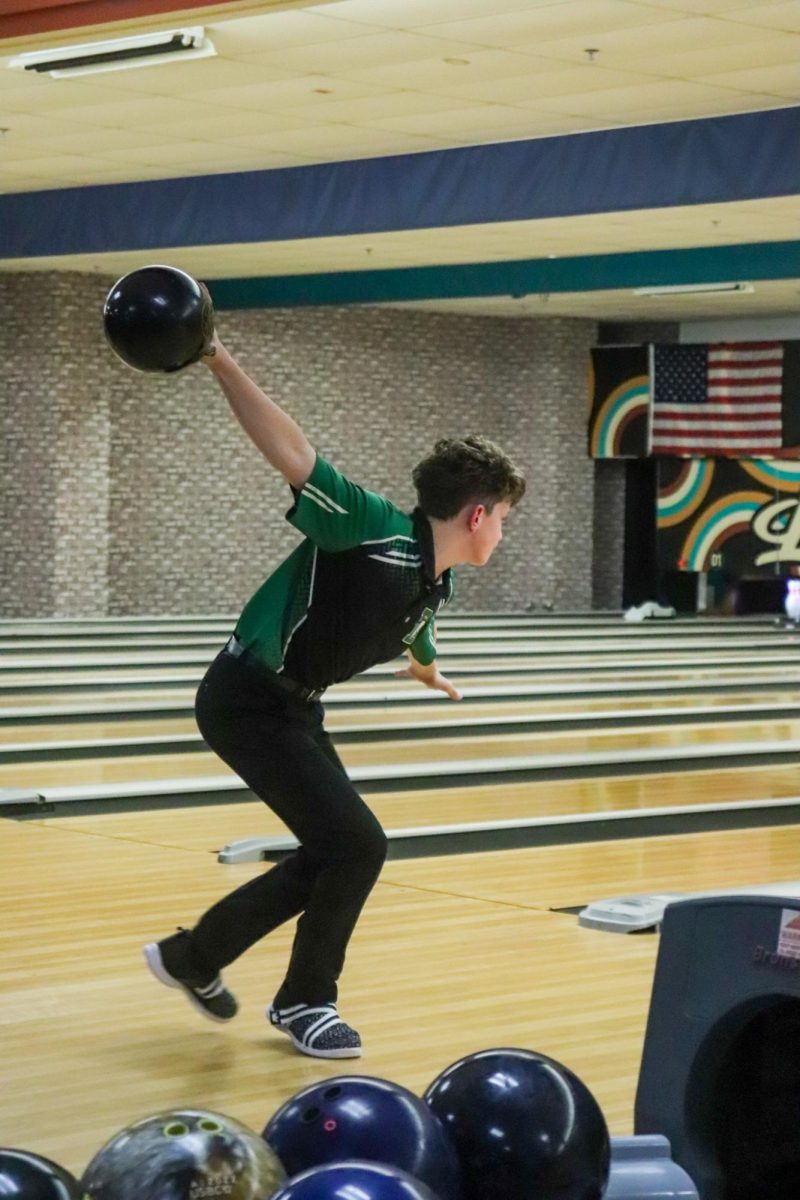 Bowler gets ready to roll the ball. 