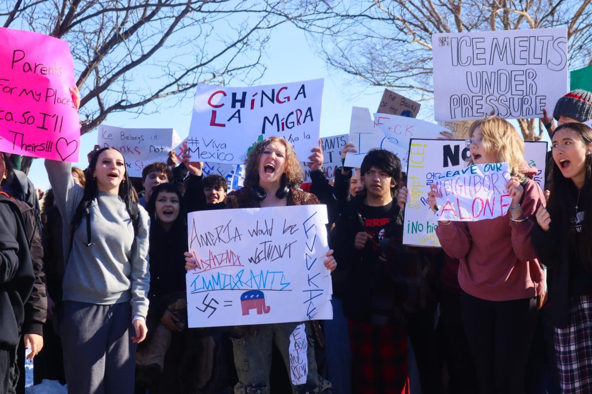 Students with posters yelling.
