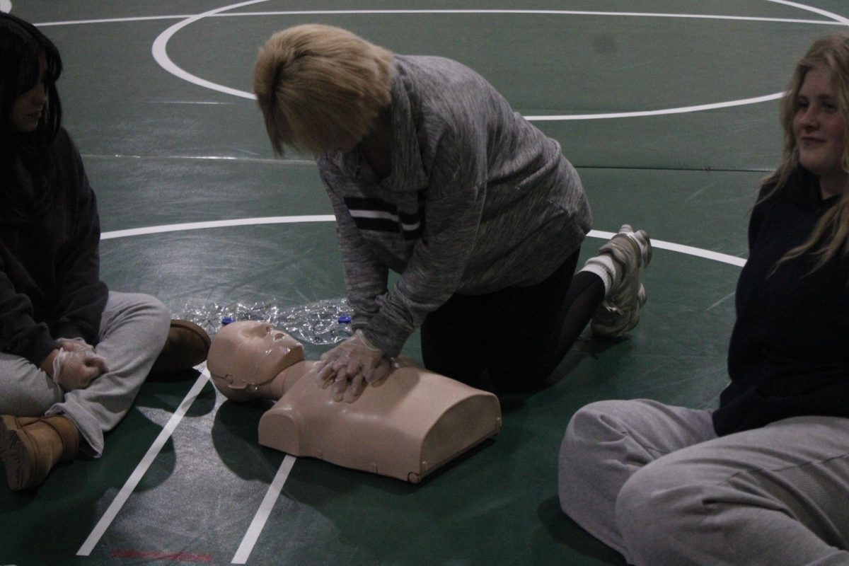 Students work on their CPR certification