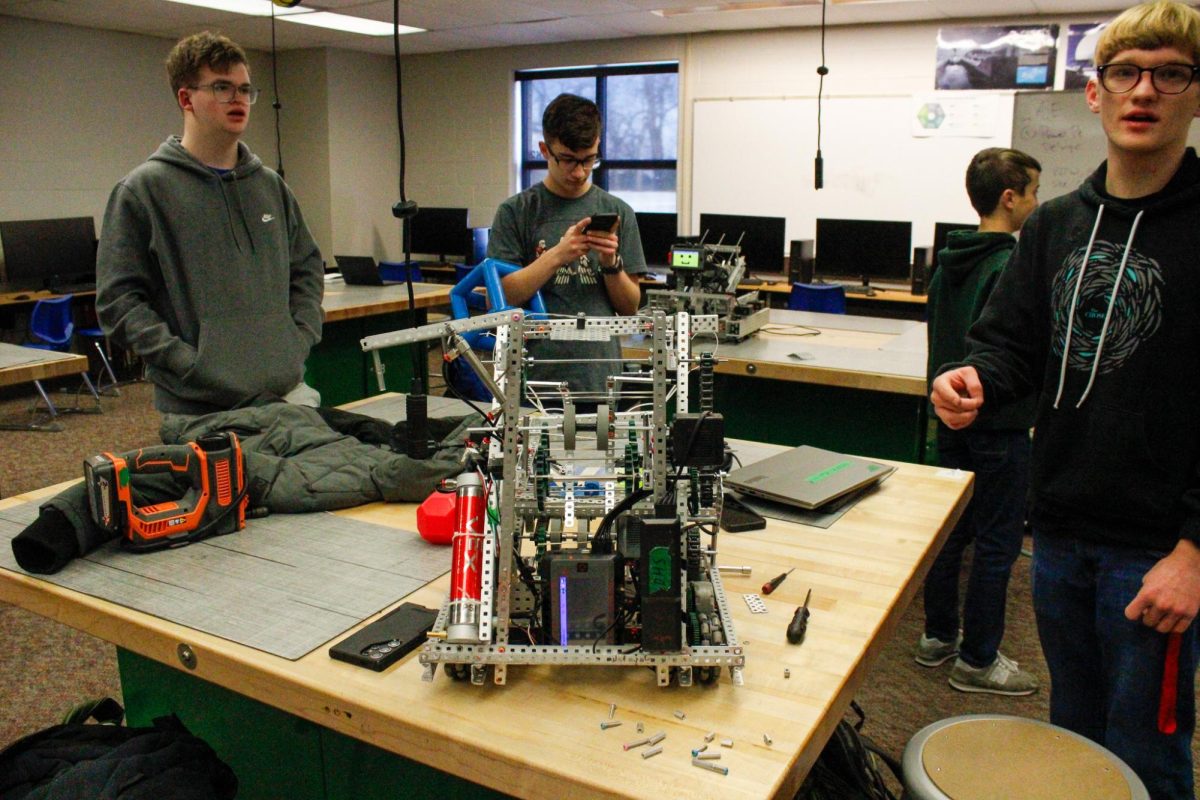 Students surround the robot.
