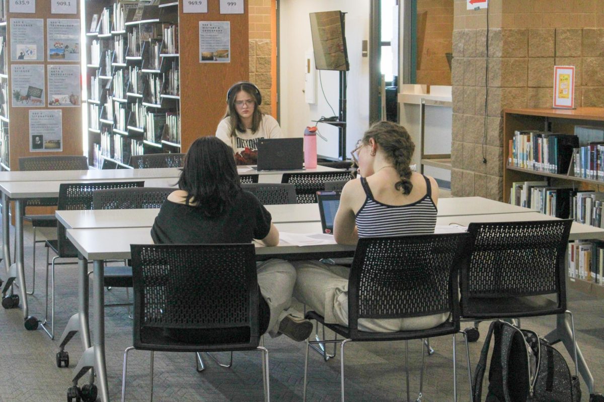 Students working diligently in the library.