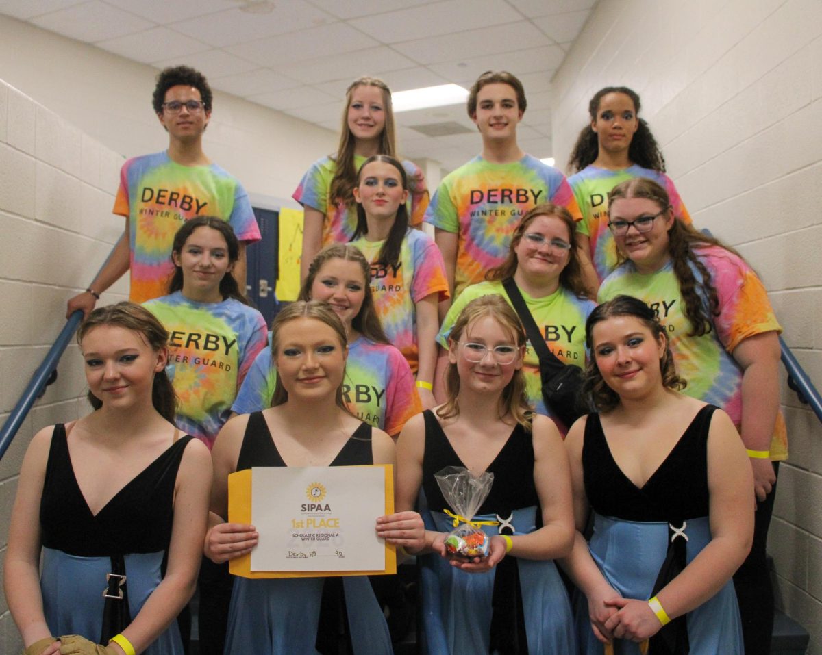 Winter guard accepting first place certificate. 