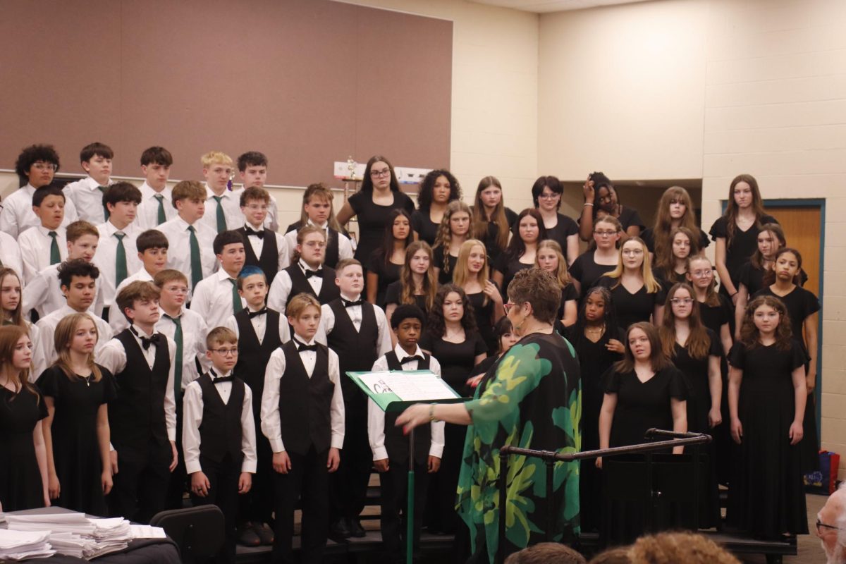 Derby Middle and Derby North sing a joint piece together. 