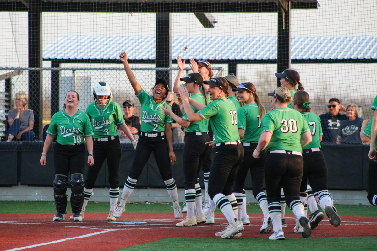 Players cheer for their teammate when they are running towards home base. 
