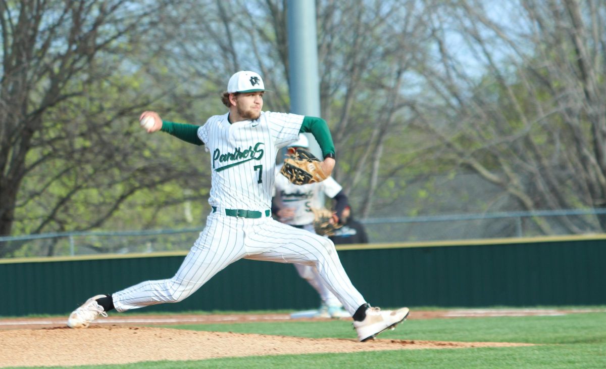 Player prepares to pitch the ball. 