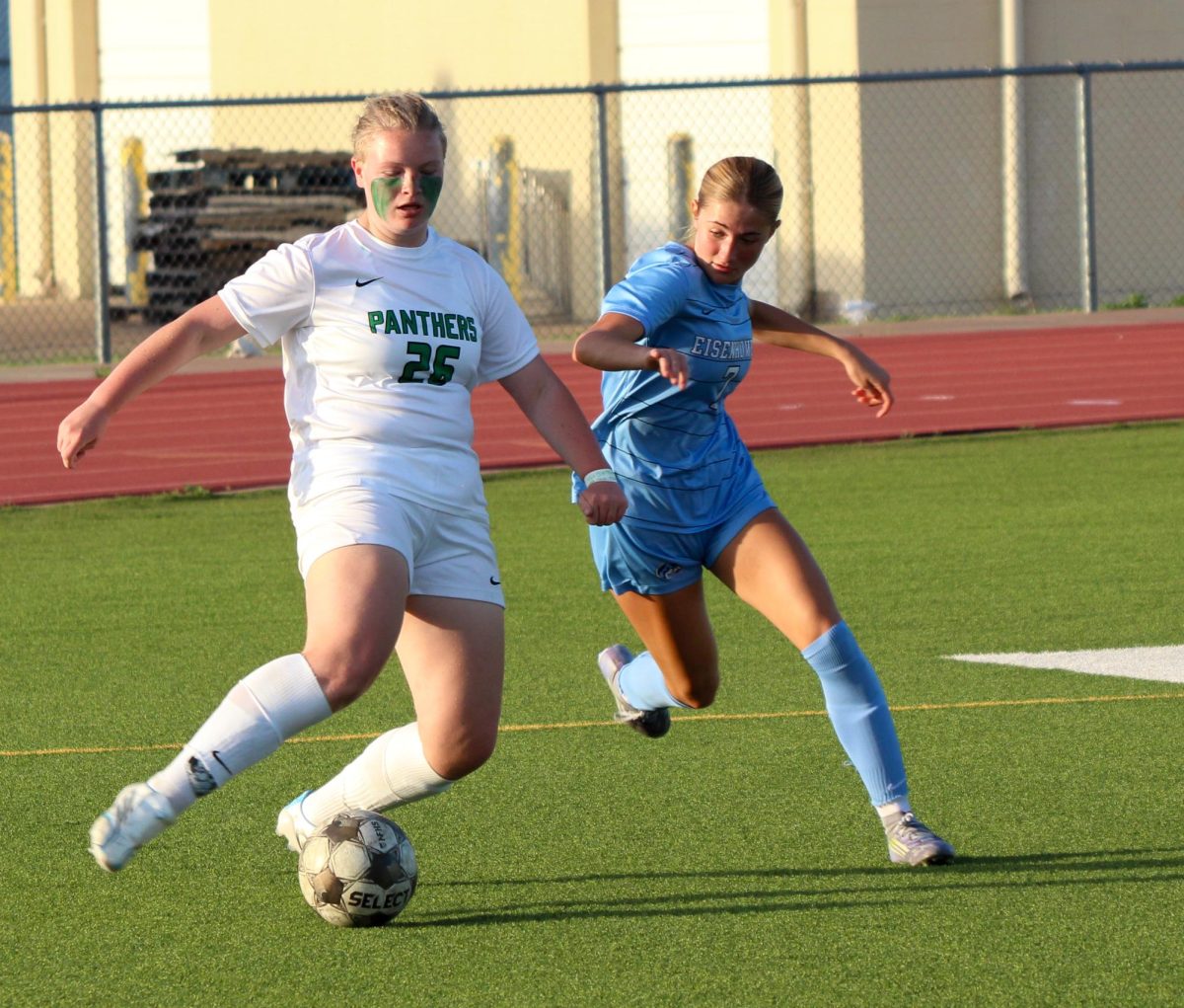 Player get ready to kick the ball. 