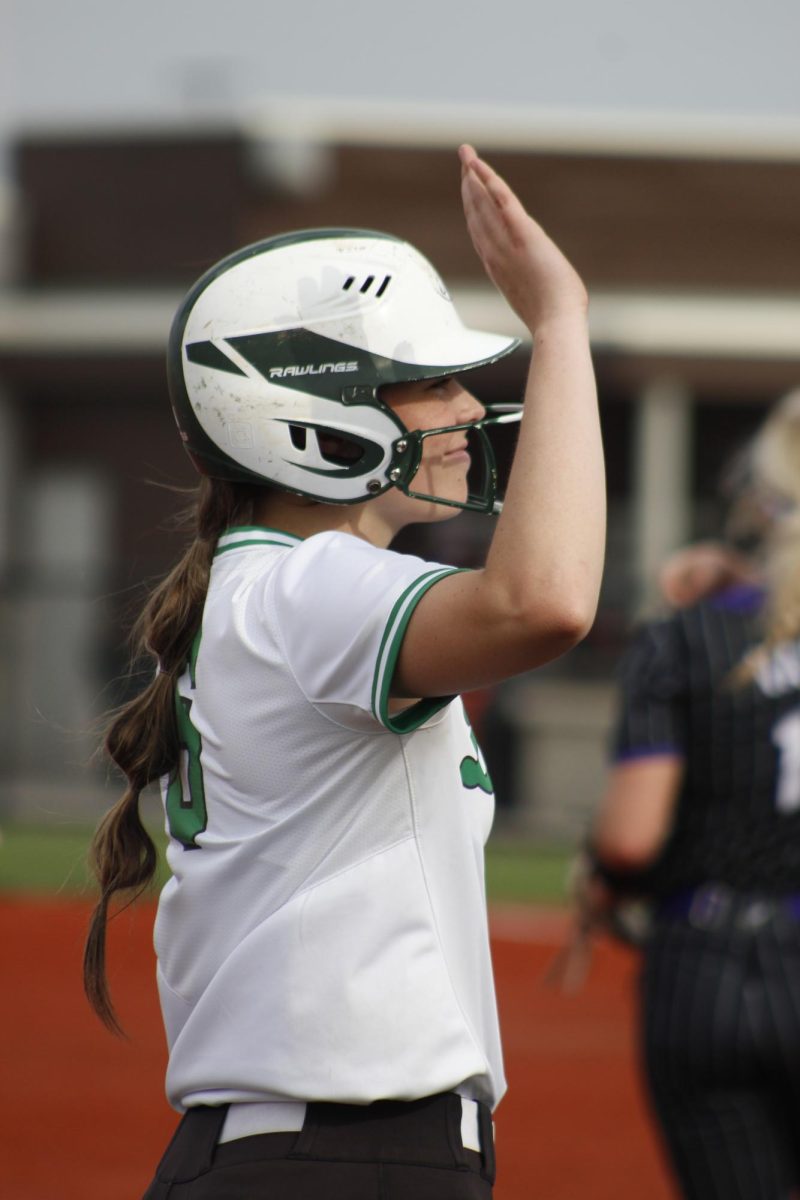 Player puts hand up for a high-five. 