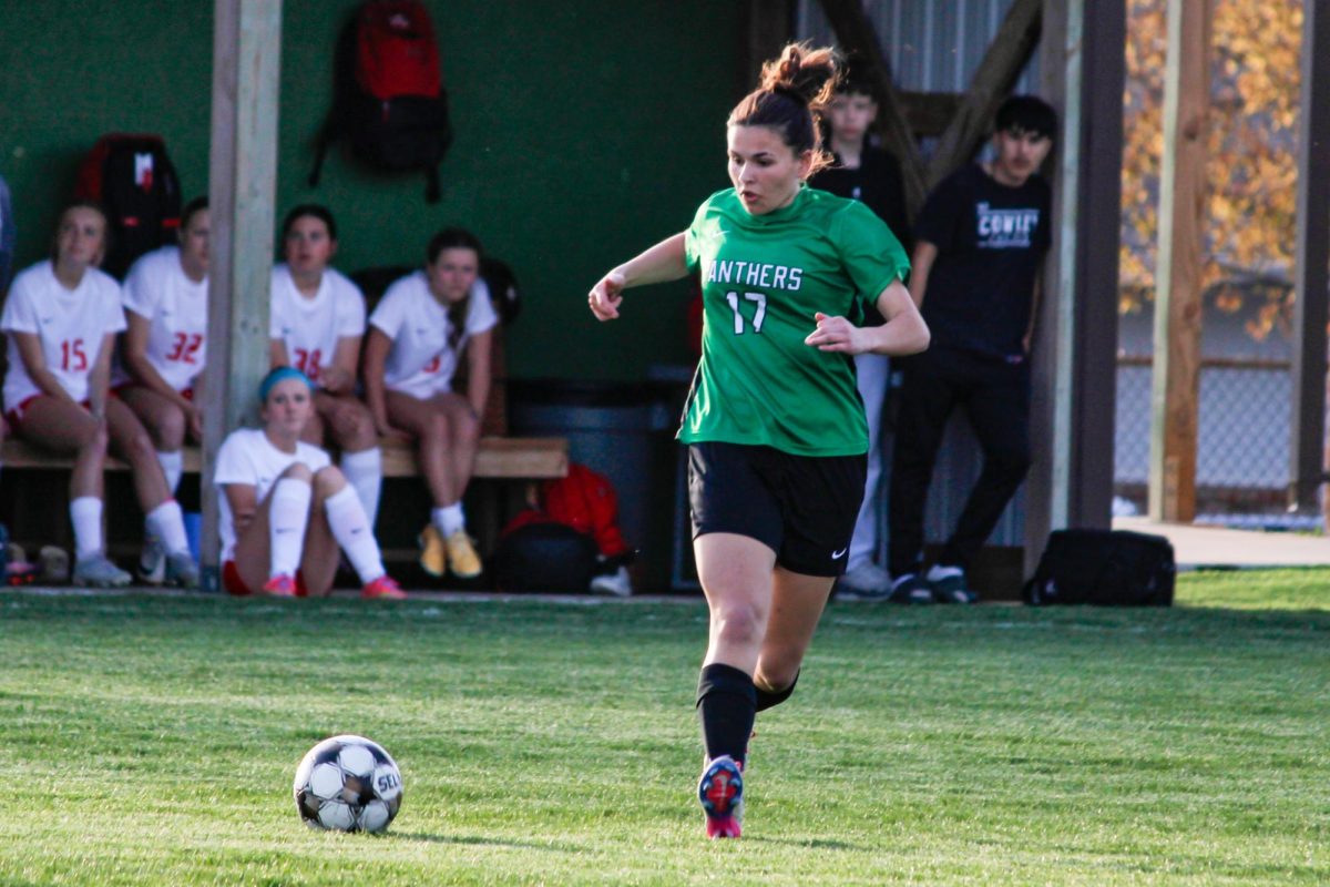 Player runs towards the ball. 
