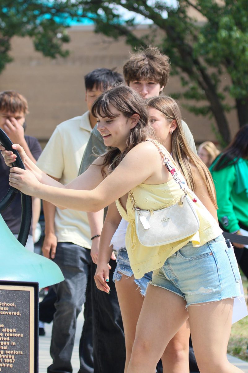 Student ringing the bell 
