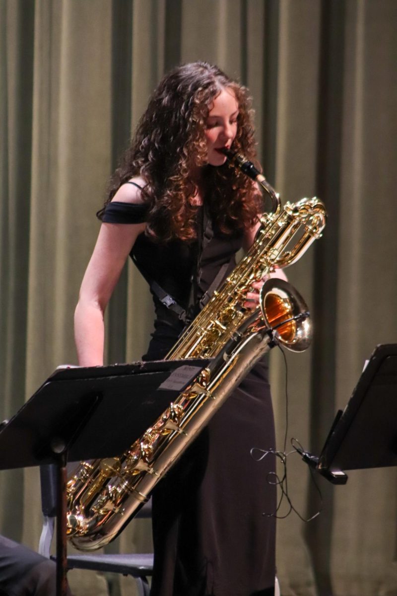Student plays her instrument during concert.