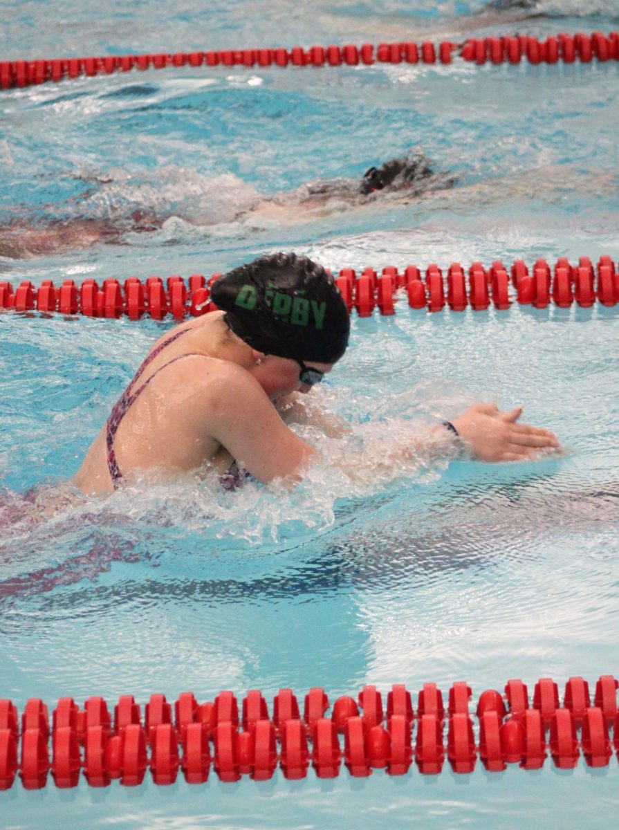 Freshman Rylee McFarren swimming breaststroke.
