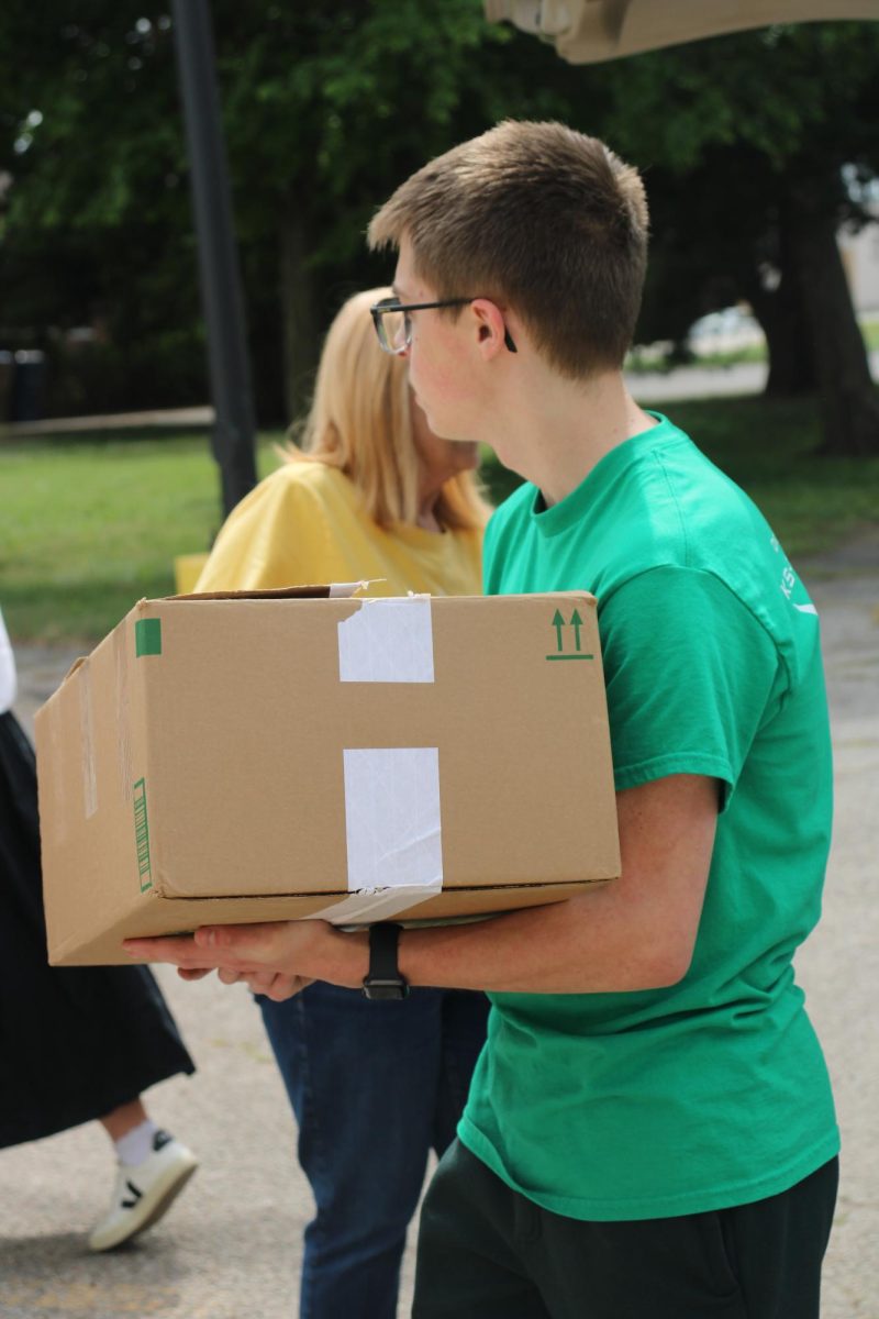 Person carries a box inside.