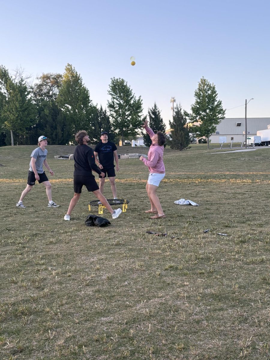 Seniors play spikeball at senior sunset. 