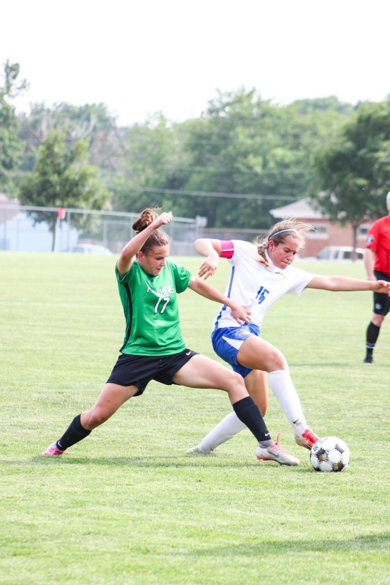 Player fights opponent to gain possession of the ball. 