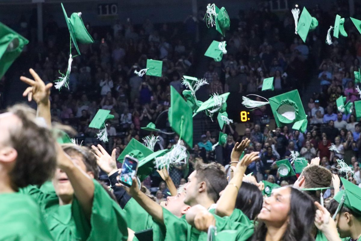 Class throwing the caps